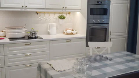 Modern White Kitchen Prepared For Home Canning With Jars And Pots Stock Footage 321824035