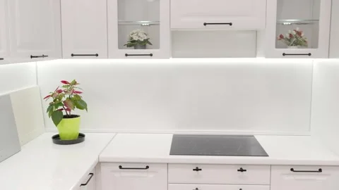 Modern white kitchen showing different countertop and backsplash samples Stock Footage 304867097