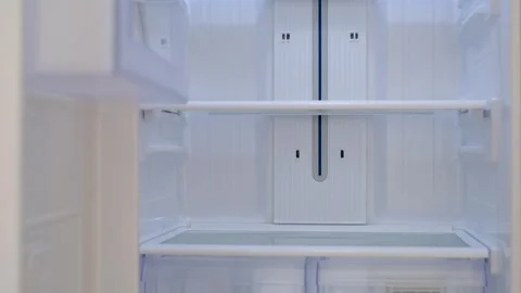 Modern white open refrigerator close-up with empty shelves, front view. Stock Footage 301025066