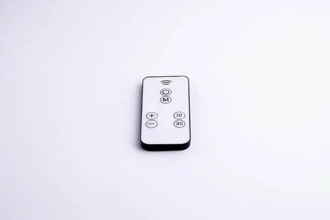 Modern white remote control isolated on white background flat lay and top vie Stock Photos