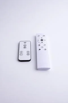 Modern white remote control isolated on white background flat lay and top vie Stock Photos