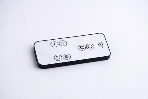 Modern white remote control isolated on white background flat lay and top vie Stock Photos