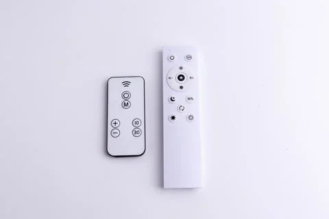 Modern white remote control isolated on white background flat lay and top vie Stock Photos