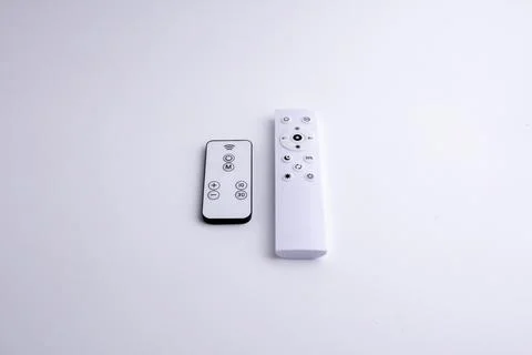 Modern white remote control isolated on white background flat lay and top vie Stock Photos