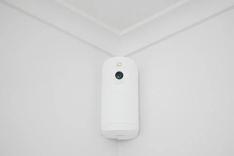 Modern white security camera CCTV on the white ceiling Stock Photos