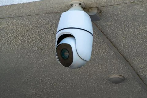 Modern White Security Camera Mounted On Ceiling Stock Photos