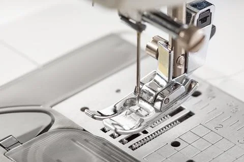 Modern white sewing machine presser foot closeup, macro Foto stock