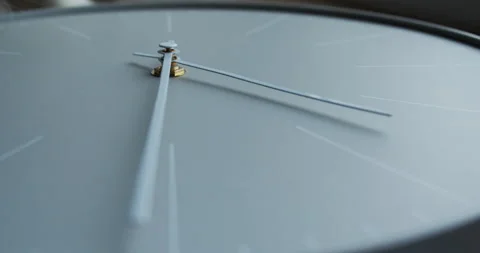 Modern white watch shows time. A cat smells the hands of the clock. Slow motion Stock Footage 148017066