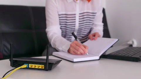 Modern wi-fi router on light table in room. 스톡 동영상 131191189
