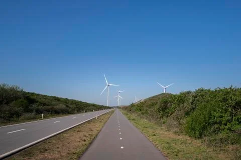 A Modern Wind Farm consisting of Wind Turbines with Two and Three Blades Stock Photos