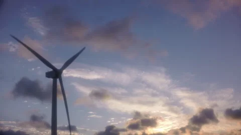 Modern wind generators standing on a mountain range against a dramatic evening s Stock Footage 341973364