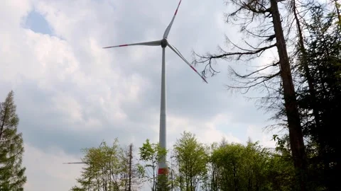 Modern wind turbines in the forest  with camera movement 4k video Stock Footage 264523525