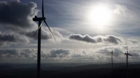 Modern wind turbines in front of a cloudy sky in 4k Stock-Footage 143783149