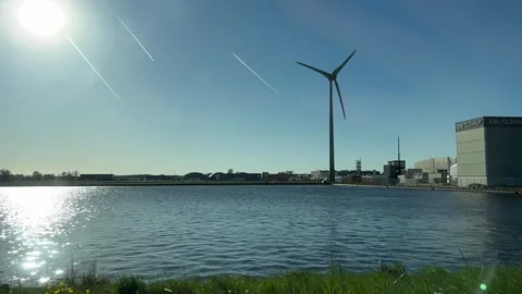 Modern wind turbines over water in the Netherlands, renewable energy landscape Stock Footage 342749845