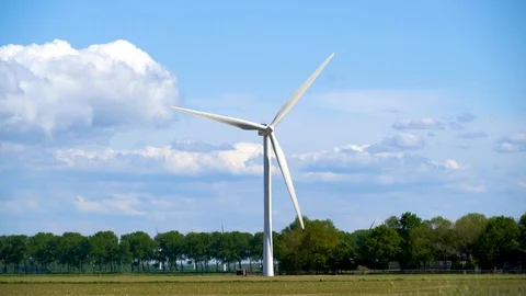 Modern windmill generation power at a Dutch landscape Stock Footage 89408497