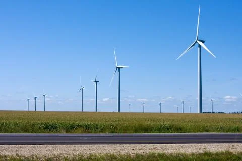 Modern windmill generators along the interstate Stock Photos