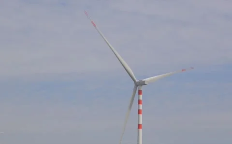 Modern Windmill Turbine Rotating Against Blue Sky for Renewable Power Generation Stock Footage 343910654