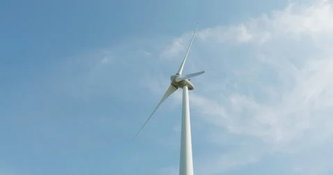 Modern windmill turing with blue sky Stock Footage 189333518