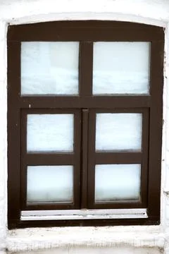 Modern window in an ancient stone wall Stock Photos