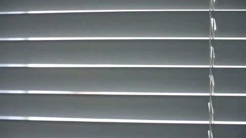 Modern window blinds opening to control sunlight and privacy indoors. Stock Footage 338191068