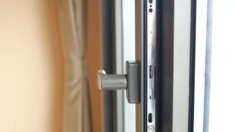 Modern window handle turning to open and close, interior close up shot with.. Stock Footage 333260412