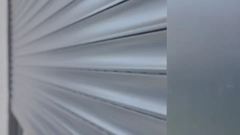 Modern window with roller shutter closing on house exterior Stock Footage 334673038