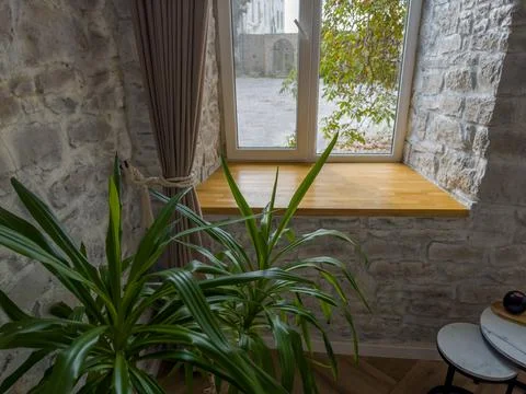 Modern window in thick stone wall in room, indoors view Stock Photos