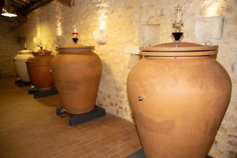 Modern wine Olive Oil terracotta amphora in the cellar Stock Photos
