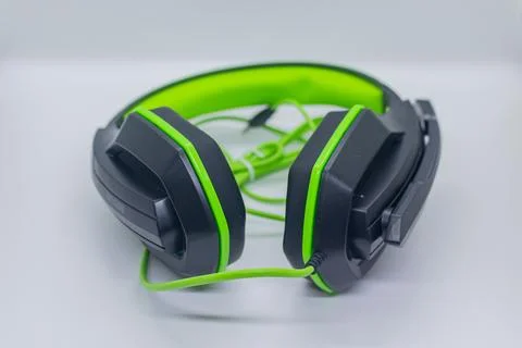Modern Wired Gaming Headset with Adjustable Headband in Black and Green on W Stock Photos