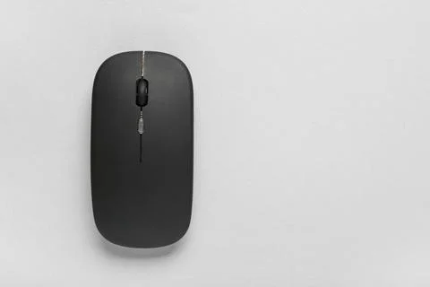 Modern wireless black computer mouse on grey background Stock Photos