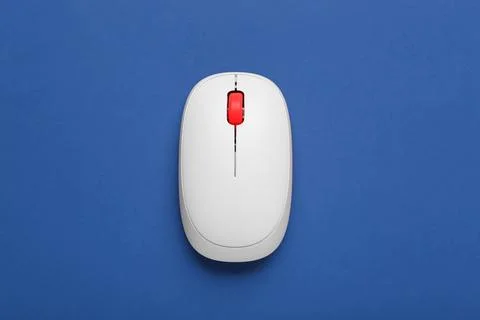 Modern wireless computer mouse on blue background Stock Photos