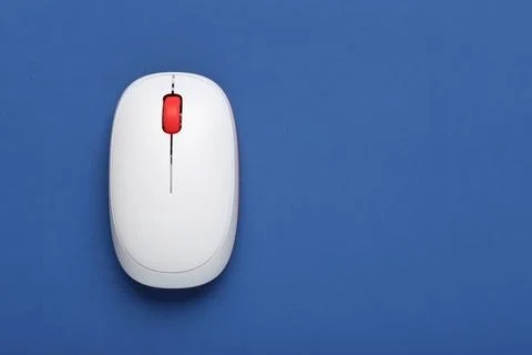 Modern wireless computer mouse on blue background Stock Photos