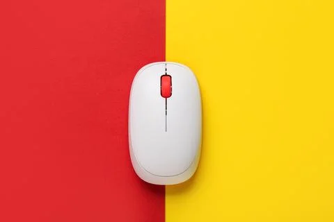 Modern wireless computer mouse on colorful background Stock Photos