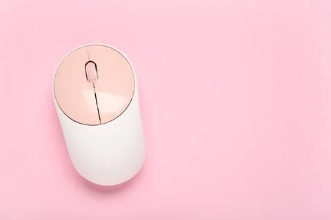 Modern wireless computer mouse on pink background Stock Photos
