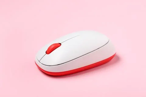 Modern wireless computer mouse on pink background Stock Photos