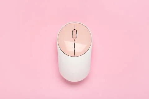 Modern wireless computer mouse on pink background Stock Photos