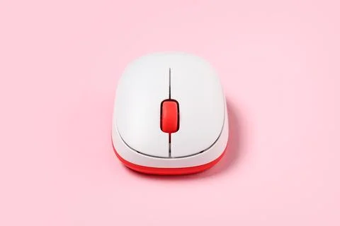 Modern wireless computer mouse on pink background Stock Photos