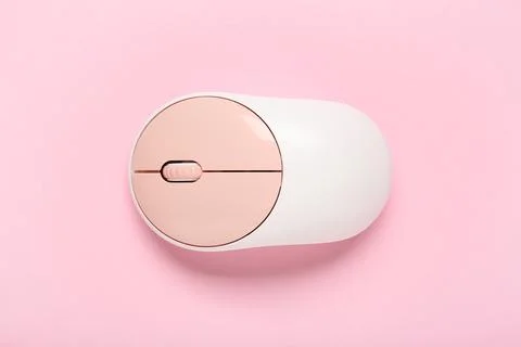 Modern wireless computer mouse on pink background Stock Photos