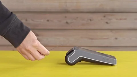Modern wireless payment banking POS terminal. Concept of problems of contactless Stock Footage 244318082