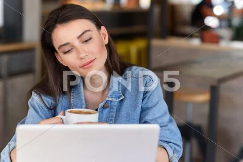 Modern woman enjoying her beverage Stock Photos
