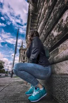 Modern woman lean on wall Stock Photos