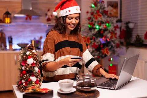 Modern woman paying for gifts with credit card Stock Photos