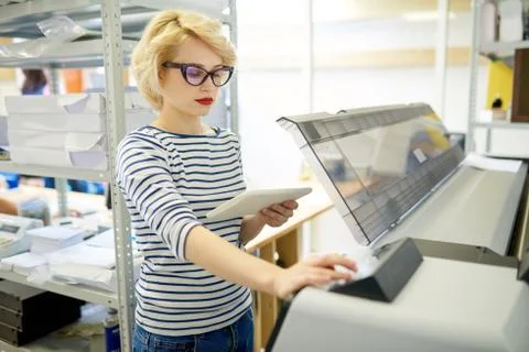 Modern Woman Using Plotter Foto stock