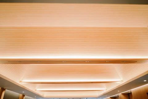 Modern Wood Panel Ceiling Design with Warm Strip Lighting Stock Photos
