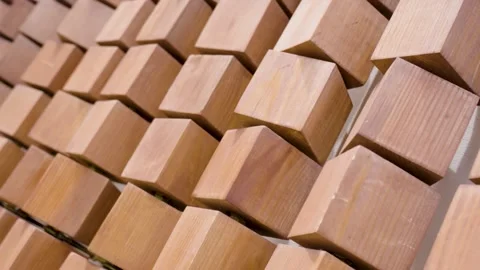 Modern wooden wall panel featuring a geometric pattern of protruding timber.. Stock Footage 334740481