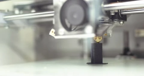Modern working 3d printer is printing black plastic object or detail automatic. Stock Footage 142695902
