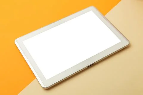 Modern working space, orange office table desk with tablet computer screen .. Stock Photos