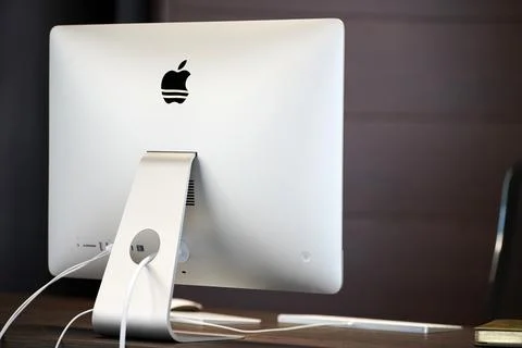 Modern workplace with Apple iMac computer. Office work place for designer. Mi Foto stock