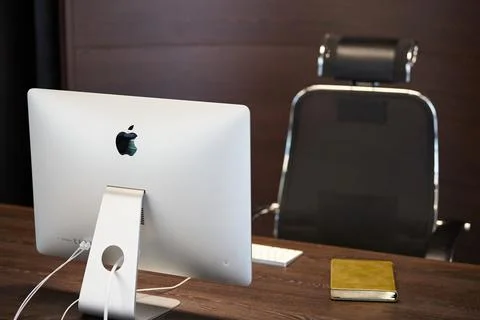 Modern workplace with Apple iMac computer. Office work place for designer. Mi Stock Photos