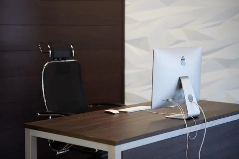 Modern workplace with Apple iMac computer. Office work place for designer. Mi 스톡 사진